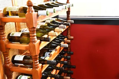 Wooden wine rack filled with bottles